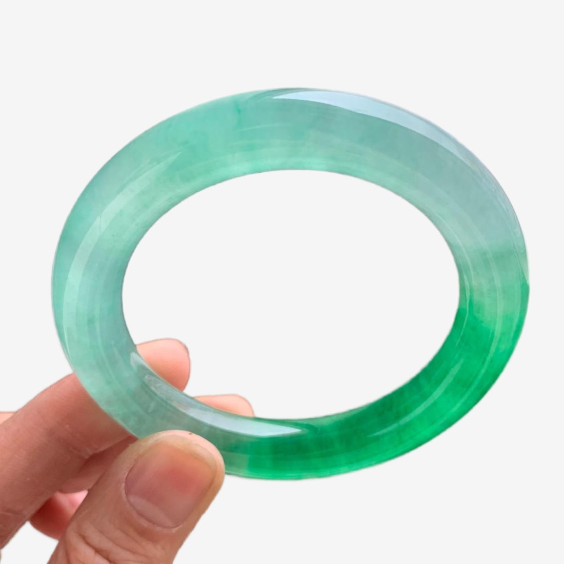 Burmese icy jadeite bangle with floating green patterns from lakes.: Burmese jadeite bangle, icy type, lake water pattern, round shape. Made of Burmese jadeite, fine texture, old jade, very beautiful on the wrist. A presentable gift for relatives, elders, or friends. F