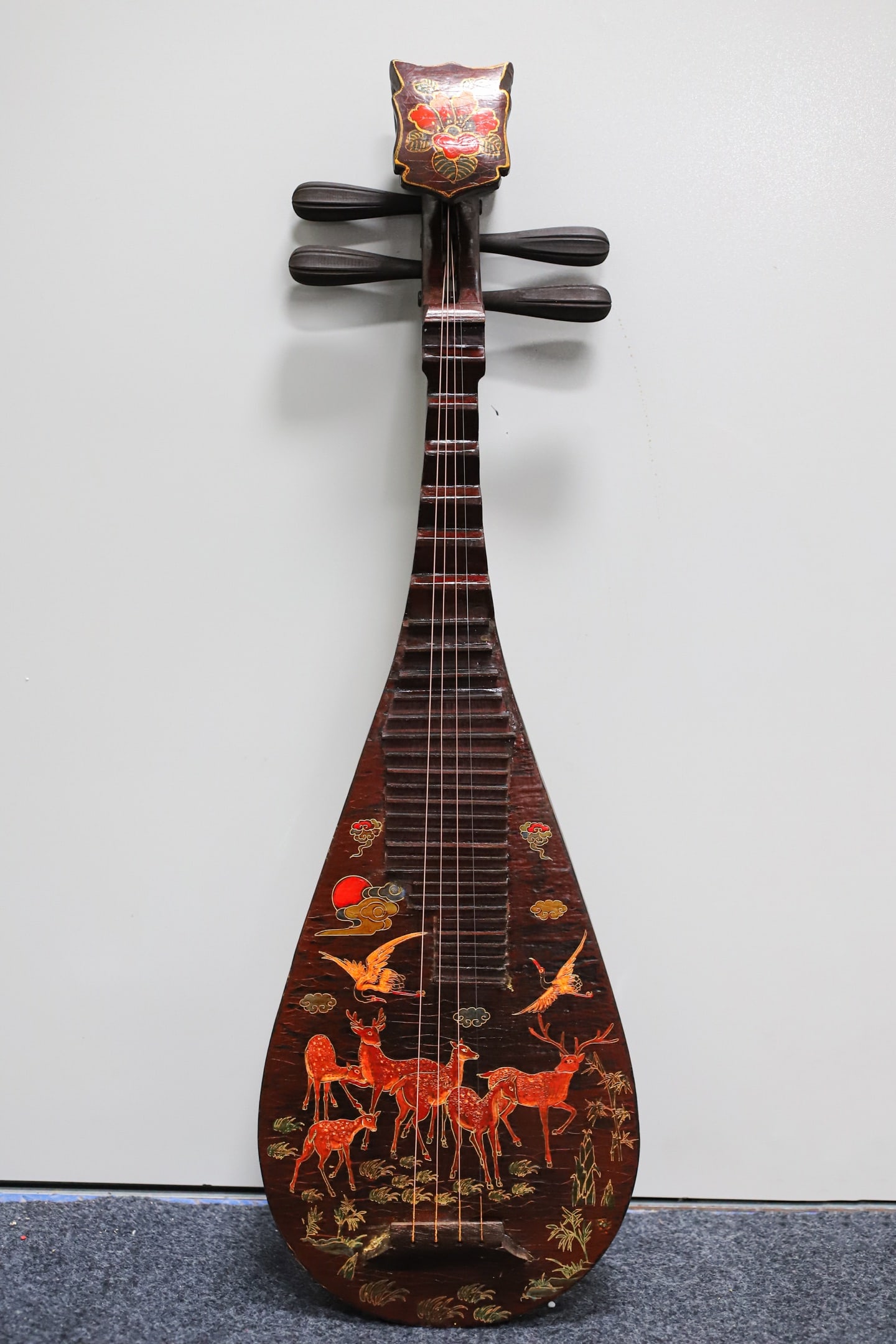A lacquered wooden pipa (a traditional Chinese stringed instrument) with painted decoration.: A lacquered, painted pipa (a traditional Chinese stringed instrument) with a wooden base, 86 cm long, 28.5 cm wide, and 9 cm thick. Provenance:Private collection of the retired lawyer Mr.Henry, Chelms