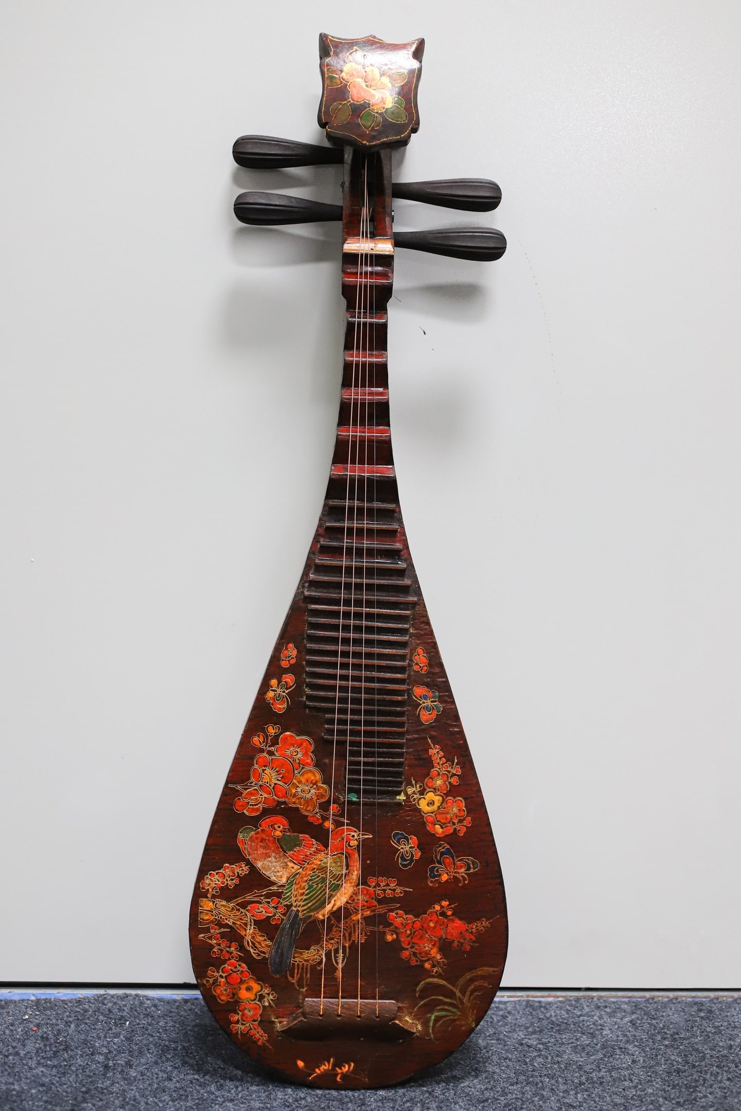 A lacquered wooden pipa (a traditional Chinese stringed instrument) with painted decoration.: A lacquered, painted pipa (a traditional Chinese stringed instrument) with a wooden base, 86 cm long, 28.5 cm wide, and 9 cm thick. Provenance:Private collection of the retired lawyer Mr.Henry, Chelms