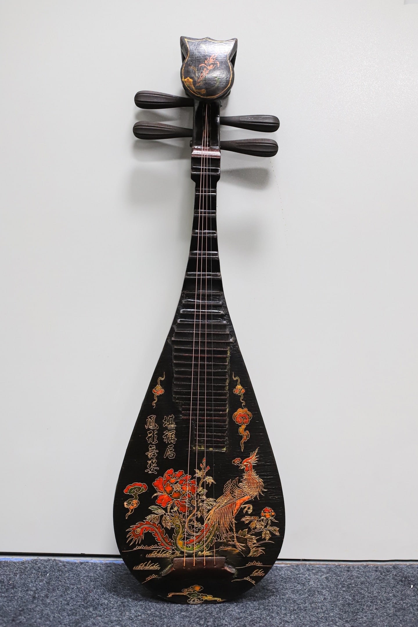 A lacquered wooden pipa (a traditional Chinese stringed instrument) with painted decoration.: A lacquered, painted pipa (a traditional Chinese stringed instrument) with a wooden base, 86 cm long, 28.5 cm wide, and 9 cm thick. Provenance:Private collection, Middletown, Rhode Island. Our dedicat