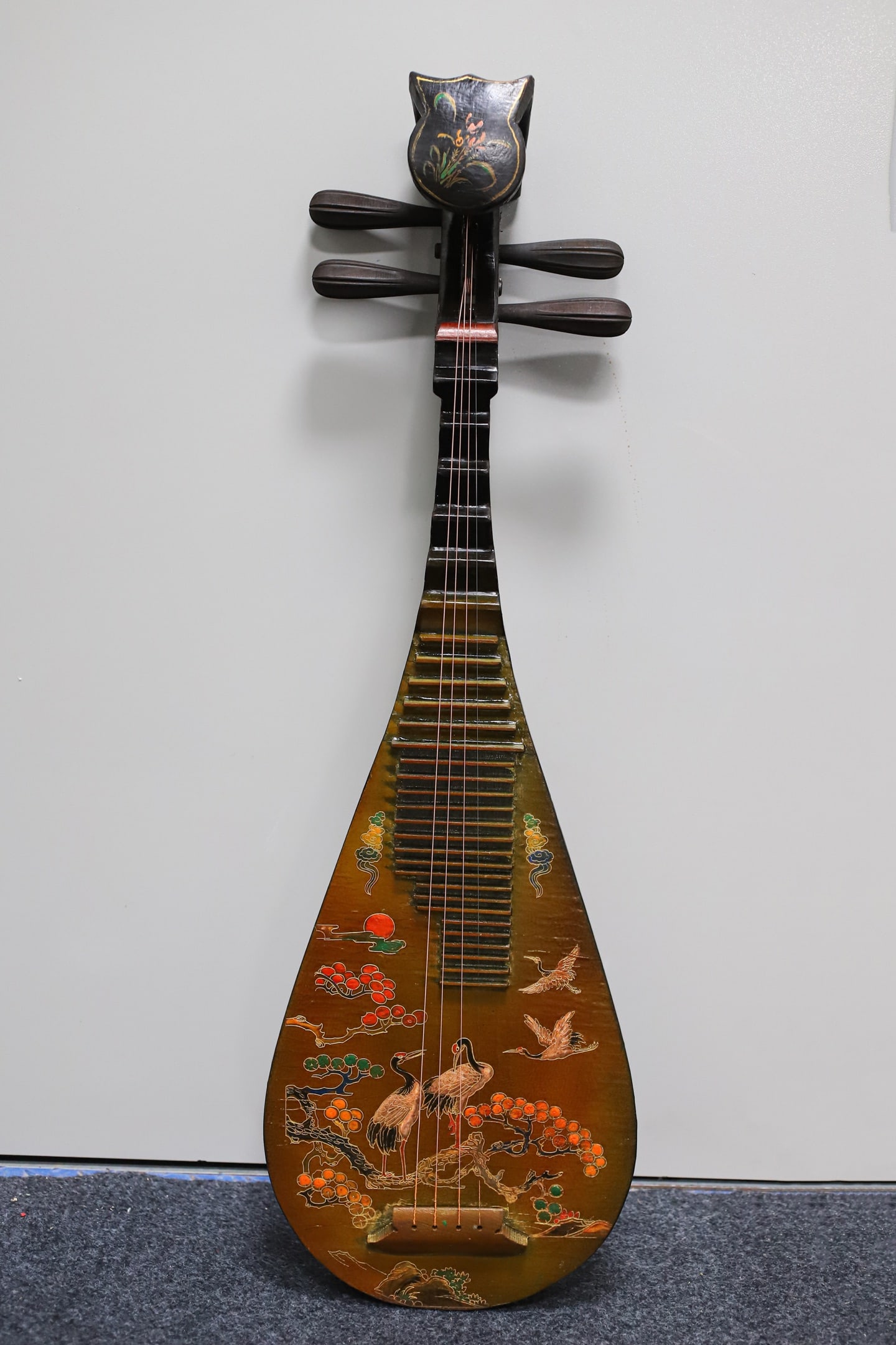 A lacquered wooden pipa (a traditional Chinese stringed instrument) with painted decoration.: A lacquered, painted pipa (a traditional Chinese stringed instrument) with a wooden base, 86 cm long, 28.5 cm wide, and 9 cm thick. Provenance:Private collection, Middletown, Rhode Island. Our dedicat