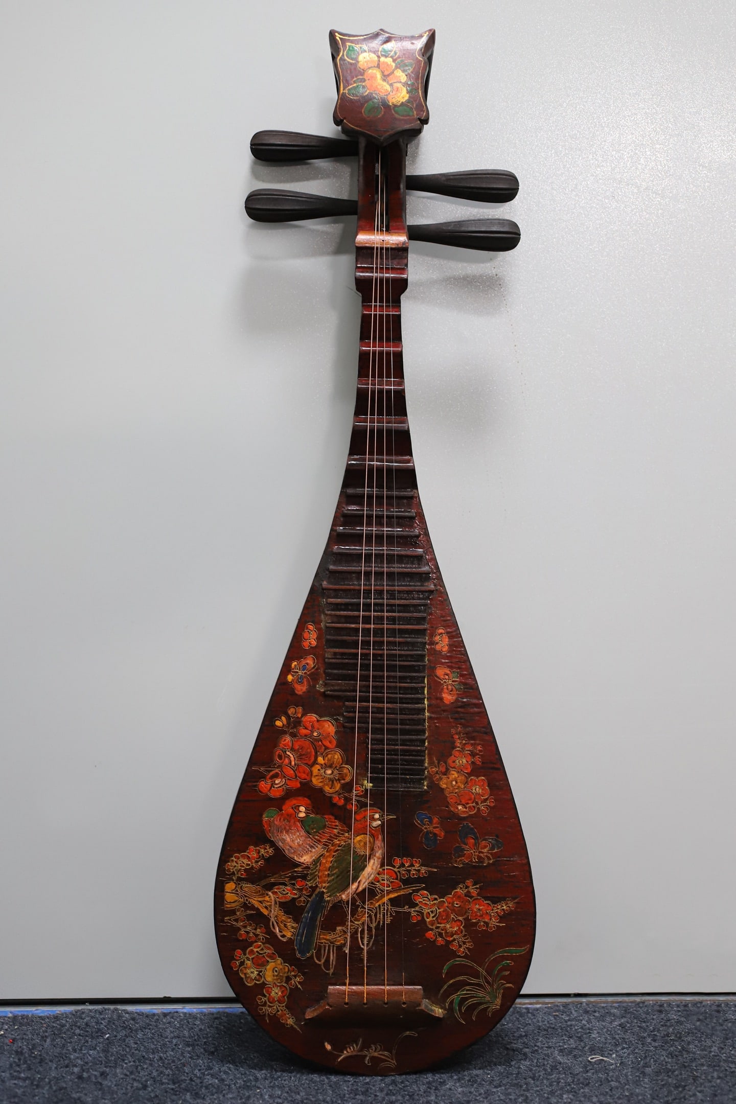 A lacquered wooden pipa (a traditional Chinese stringed instrument) with painted decoration.: A lacquered, painted pipa (a traditional Chinese stringed instrument) with a wooden base, 86 cm long, 28.5 cm wide, and 9 cm thick. Provenance:From a private collection in San Diego, California, USA.
