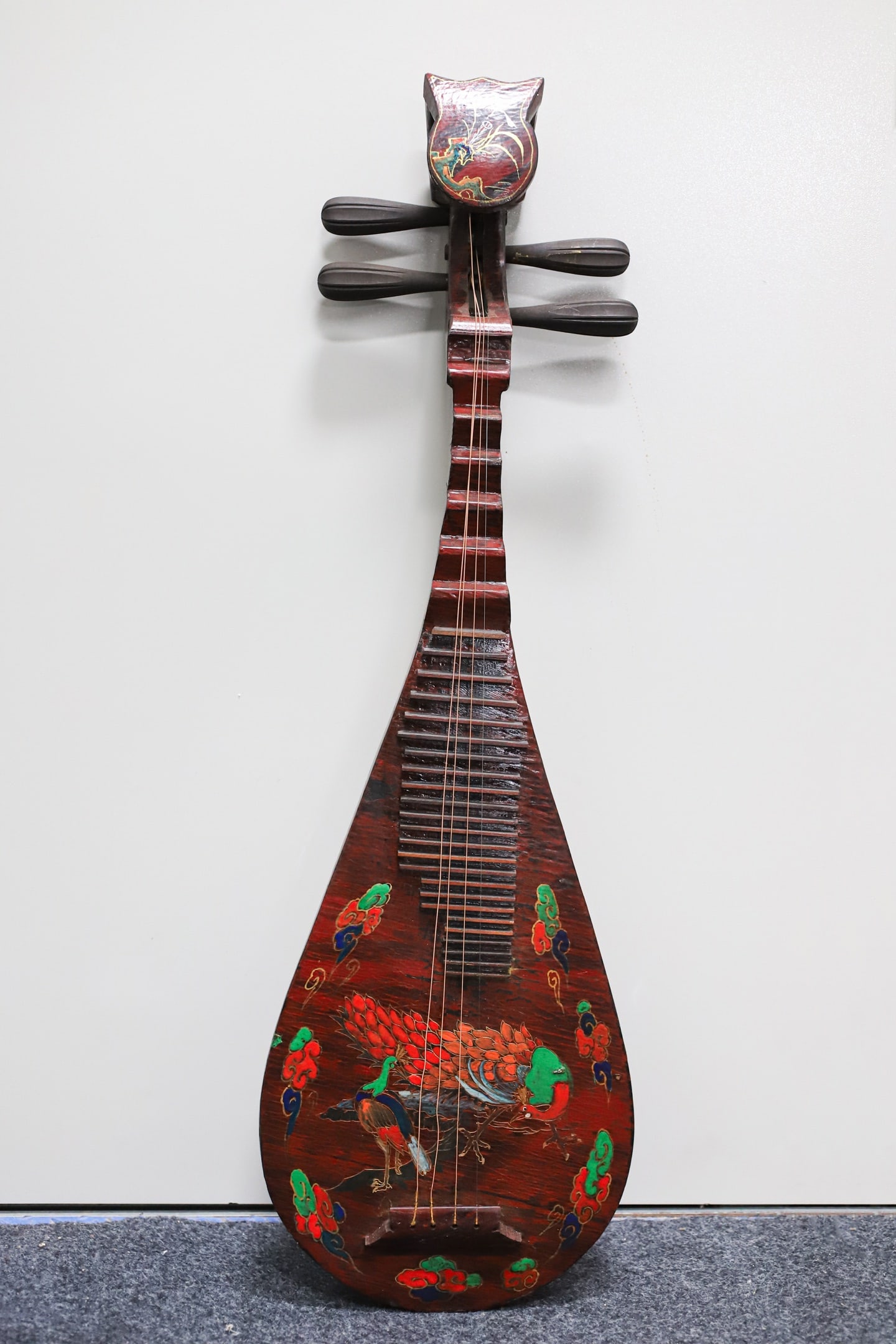 A lacquered wooden pipa (a traditional Chinese stringed instrument) with painted decoration.: A lacquered, painted pipa (a traditional Chinese stringed instrument) with a wooden base, 86 cm long, 28.5 cm wide, and 9 cm thick. Provenance:From a private collection in San Diego, California, USA.
