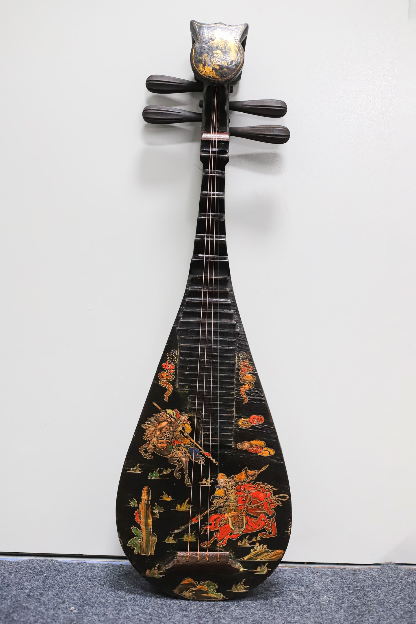 A lacquered wooden pipa (a traditional Chinese stringed instrument) with painted decoration.: A lacquered, painted pipa (a traditional Chinese stringed instrument) with a wooden base, 86 cm long, 28.5 cm wide, and 9 cm thick. Provenance:From a private collection in San Diego, California, USA.