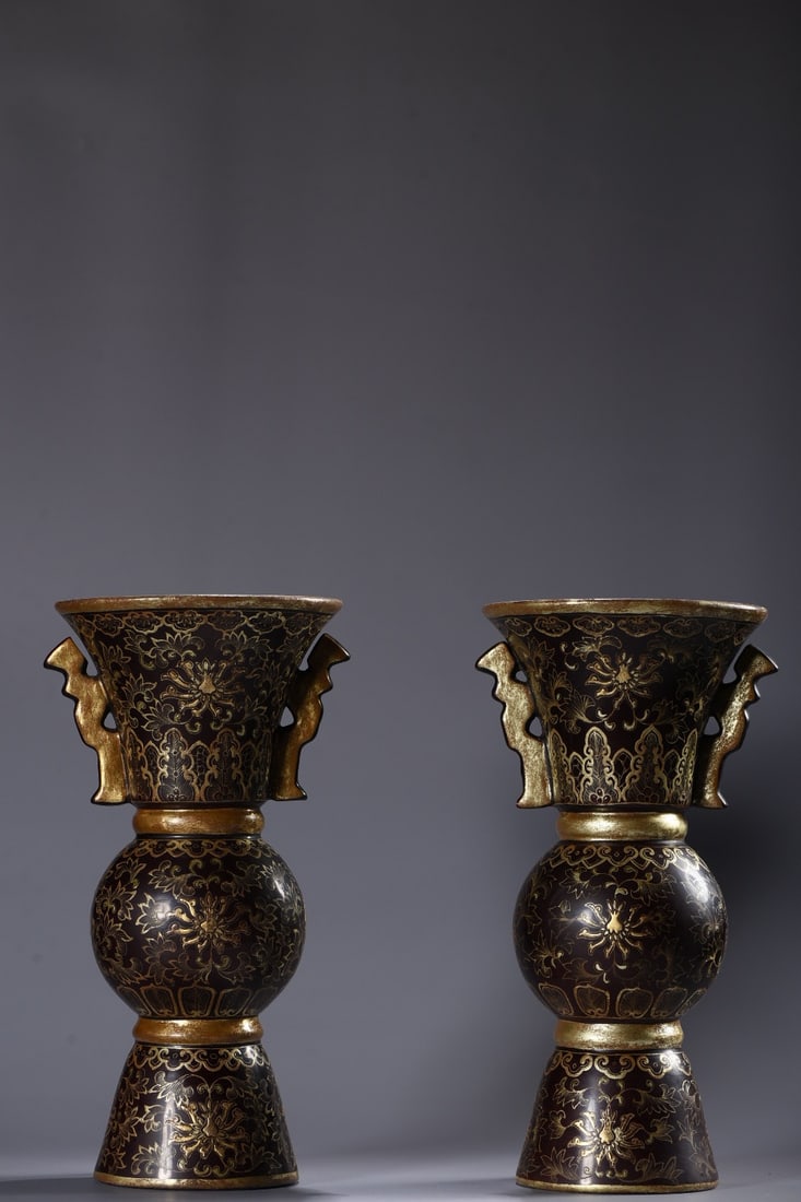 A pair of porcelain lacquerware vases with gold-painted lotus scroll patterns and animal-head (1 of 9)
