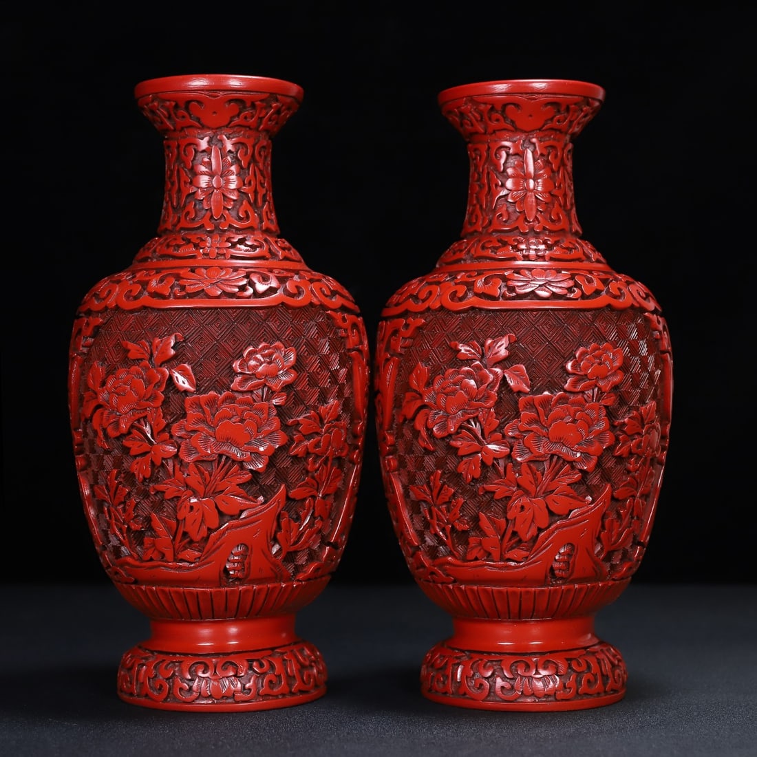 A pair of carved red lacquer vases from an old collection: A pair of carved red lacquer vases, 12.5 cm in diameter and 25 cm in height, from a collection of the former owners. Provenance:Private collection from a professor in Harvard University. Our dedicated