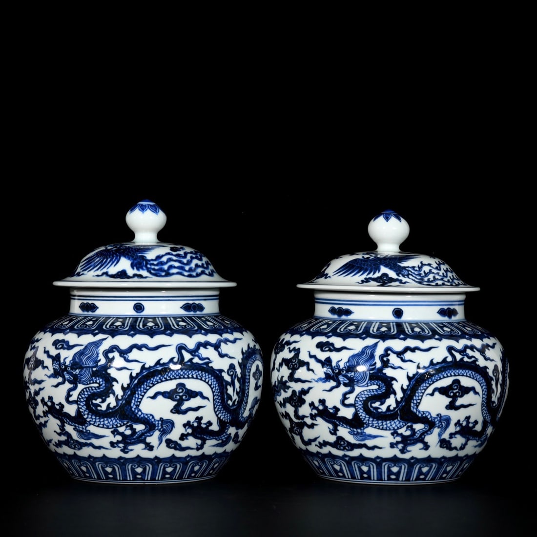 A pair of blue and white porcelain covered jars with dragon and phoenix designs from the Xuande (1 of 9)