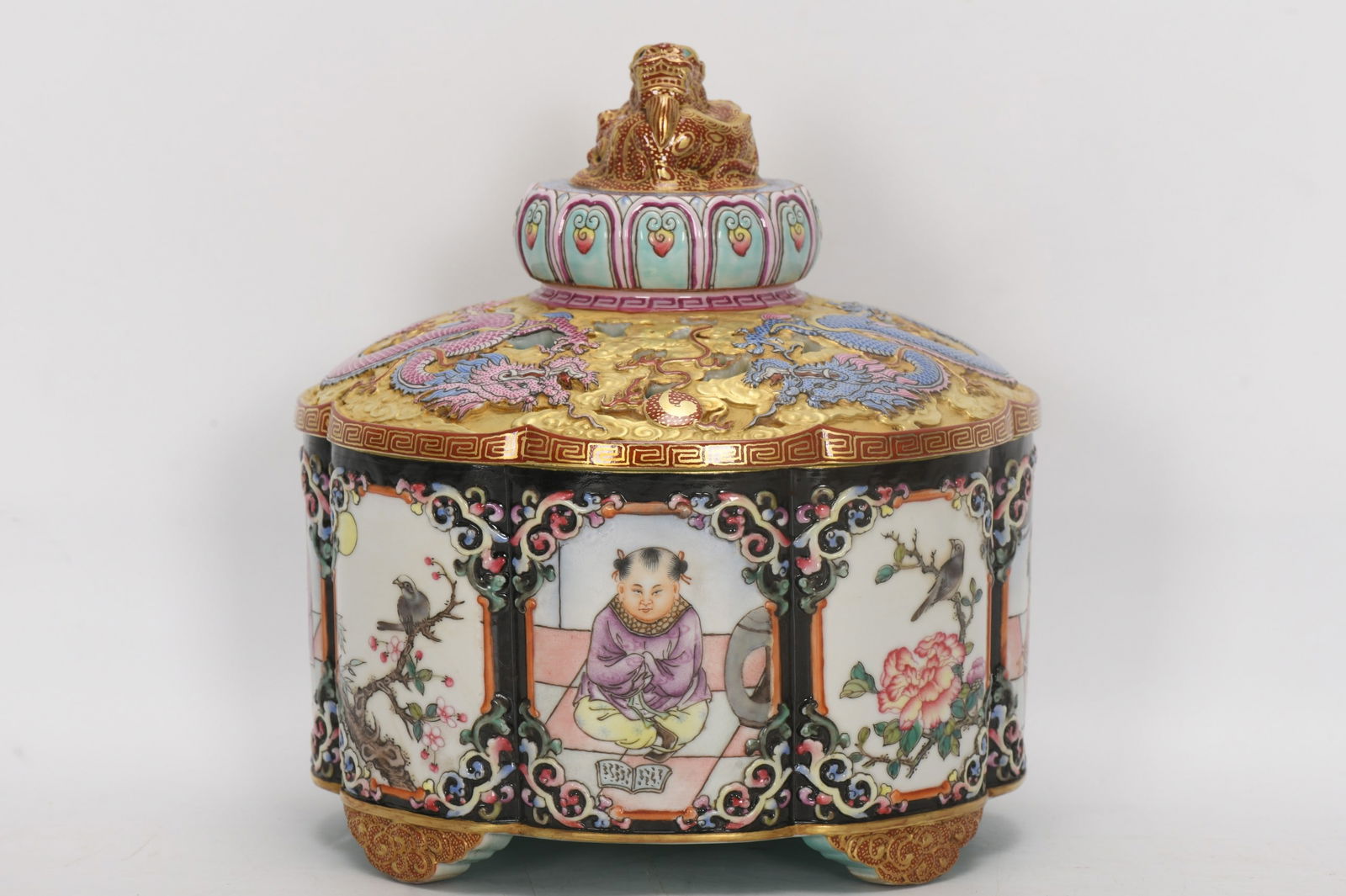 A Qing Dynasty Qianlong period enamel-carved incense burner with four sides depicting flowers and (1 of 8)