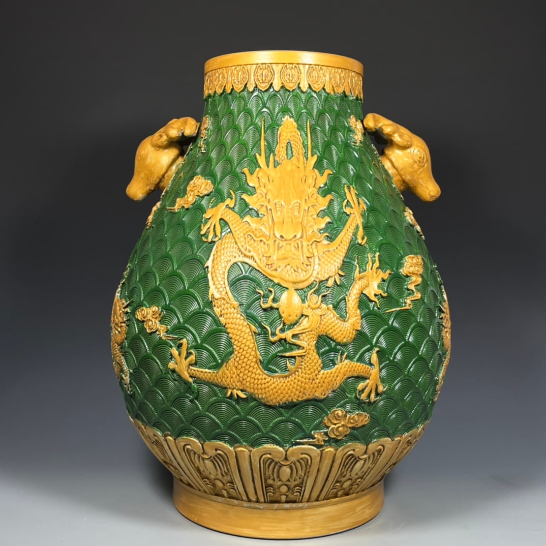 A Qing Dynasty Qianlong period green-ground gilt-painted high-relief carved deer head vase with five: Height 41 cm, width 28.5 cm Provenance:Mr. Stefan, Minneapolis, Minnesota. Our dedicated team expertly handles both domestic and global shipping arrangements.We accept wire transfer and credit or debi
