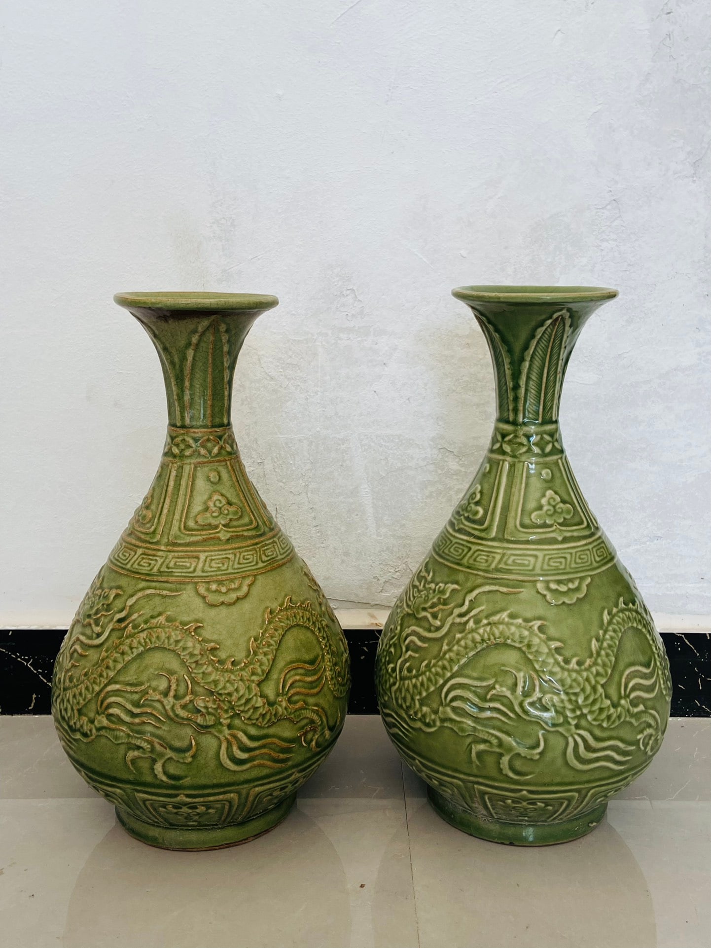 A pair of Longquan celadon dragon-patterned appreciation vases from my collection: A pair of Longquan celadon dragon-patterned appreciation vases from my collection Provenance:Mr. Stefan, Minneapolis, Minnesota. Our dedicated team expertly handles both domestic and global shipping a