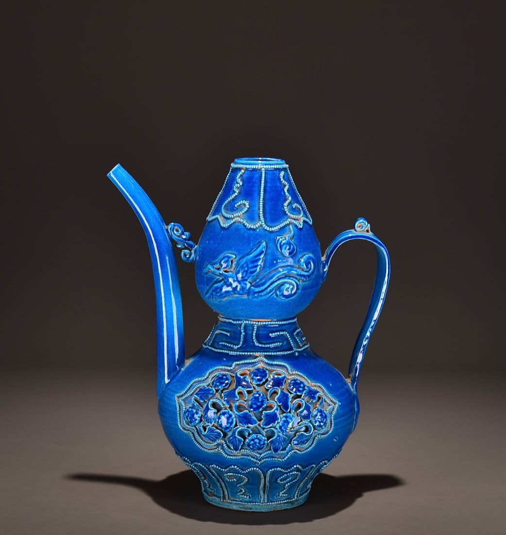 A Ming Dynasty peacock blue sculpted flower ewer from a former collection!: Dimensions: Height 32cm, Width 26cm Provenance:Mr. Stefan, Minneapolis, Minnesota. Our dedicated team expertly handles both domestic and global shipping arrangements.We accept wire transfer and credit