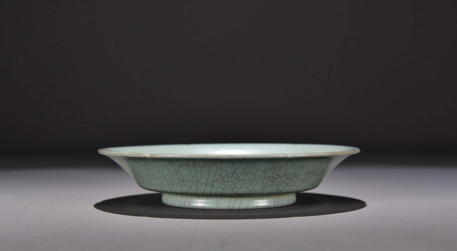 Former collection of Song Dynasty Ru ware celadon plate: Dimensions: Height 4, Width 19 Provenance:Private Estate, Michigan. Our dedicated team expertly handles both domestic and global shipping arrangements.We accept wire transfer and credit or debit card