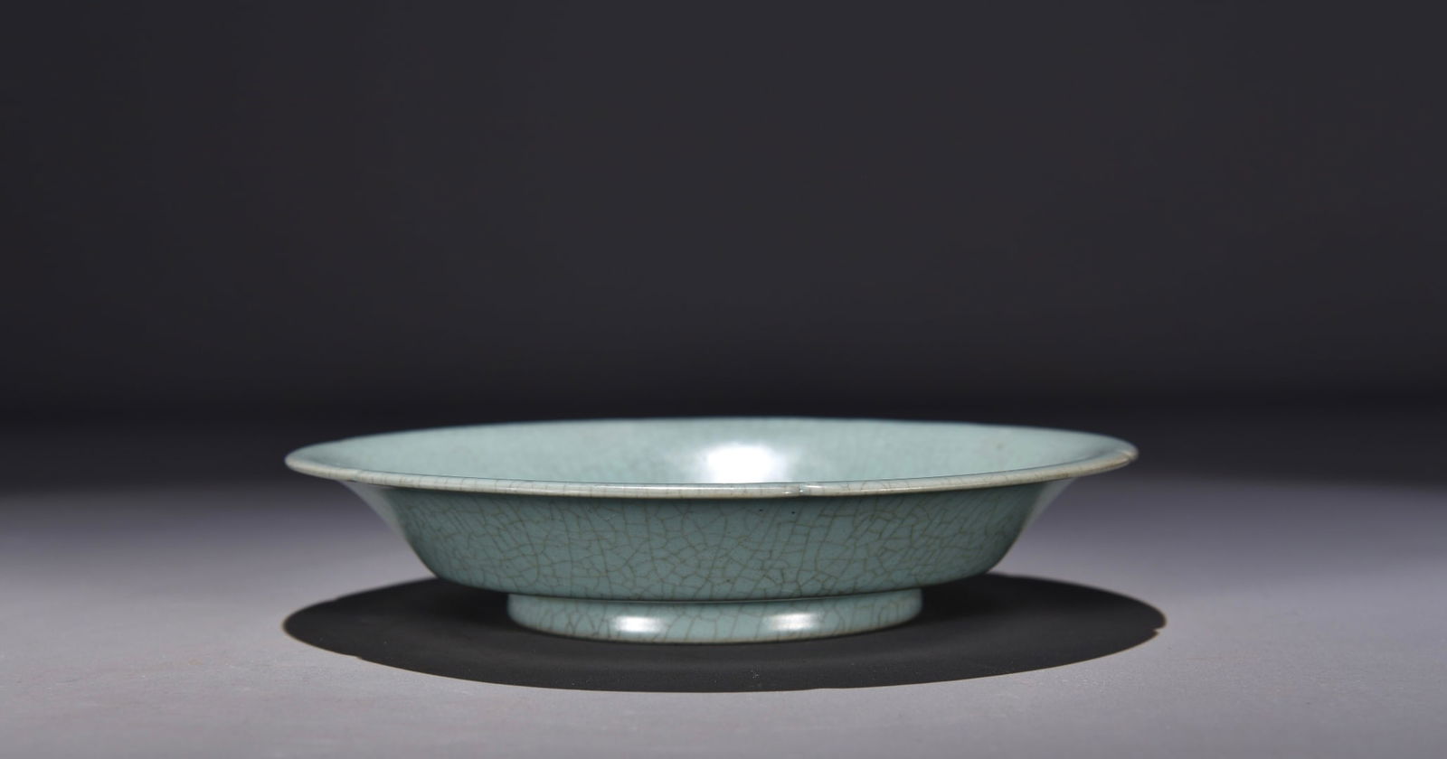 Former collection of Song Dynasty Ru ware celadon plate: Dimensions: Height 4 x Width 20 Provenance:Private Estate, Michigan. Our dedicated team expertly handles both domestic and global shipping arrangements.We accept wire transfer and credit or debit card