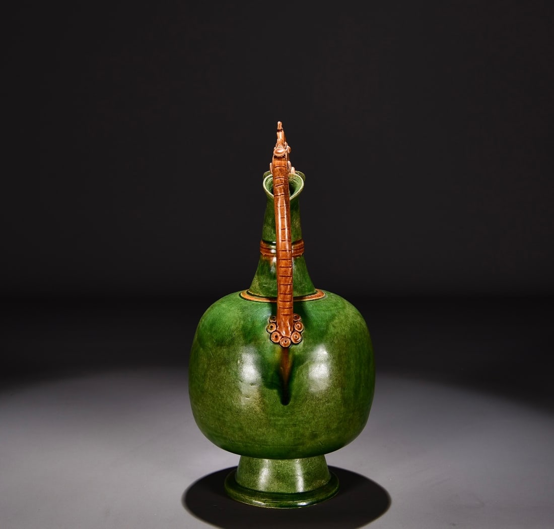 Formerly in the collection of a Tang Dynasty green-glazed dragon-handled flower ewer (1 of 9)