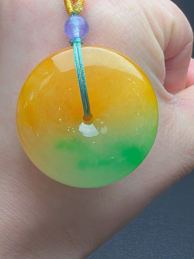 Jadeite of glutinous, icy type with yellow jadeite and floating green hues, "Peace Buckle, Bread (1 of 9)