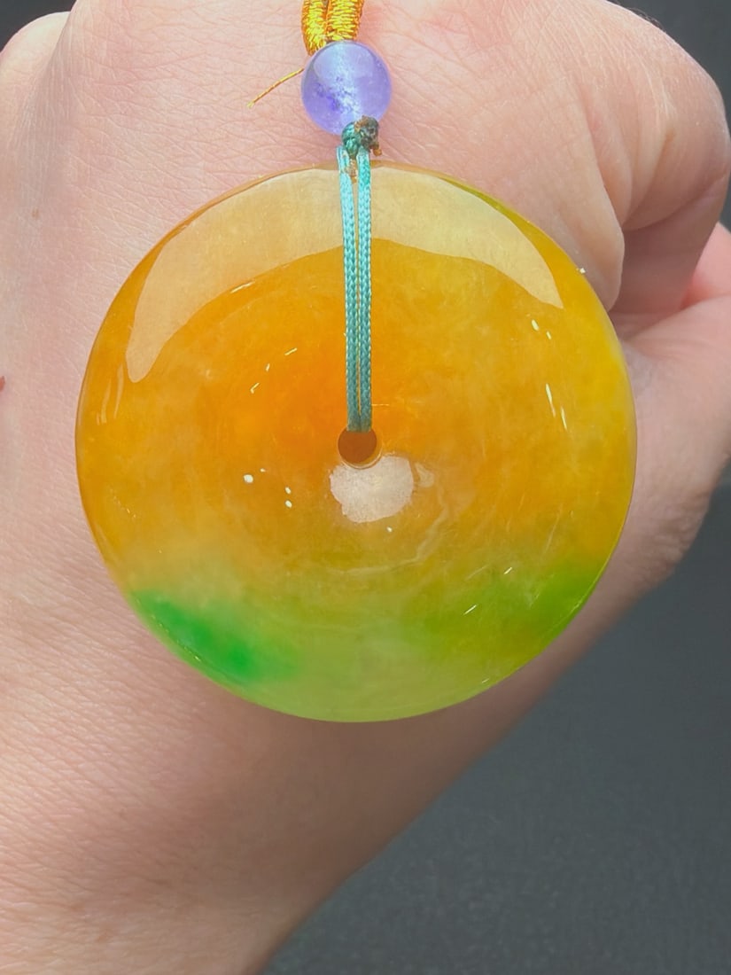 Jadeite of glutinous, icy type with yellow jadeite and floating green hues, "Peace Buckle, Bread (1 of 9)