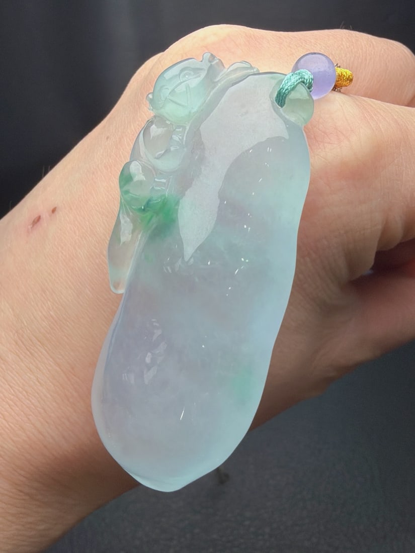 Jadeite of icy texture with floating patterns, symbolizing continuous advancement.: The jadeite, of the icy type with floating patterns, is named "Rising Step by Step." It is translucent and lustrous, finely carved, thick and full, with excellent texture and translucency. Provenance: