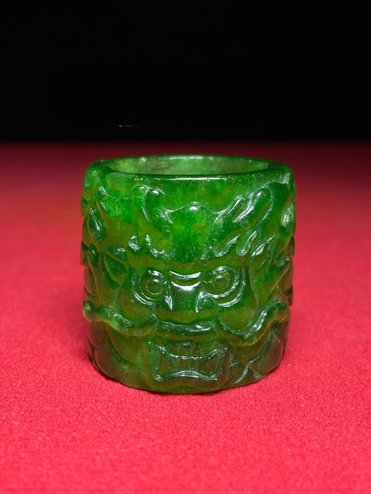 Formerly owned collection of finely carved dragon-head thumb ring made of high-quality, full-green (1 of 6)
