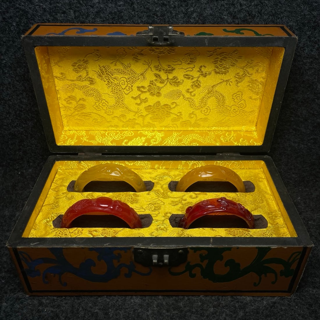 A jade bracelet with intricate carvings is found inside a lacquerware collection box made by the (1 of 9)