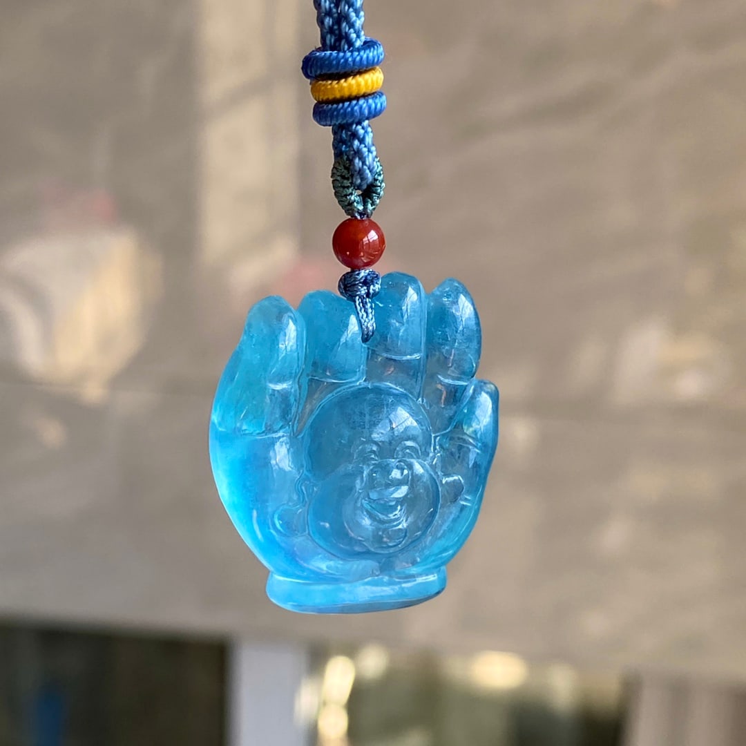 Natural aquamarine carved Buddha pendant: This natural aquamarine carved Buddha pendant is a beautiful deep blue color, with exquisite carving. It measures 30 x 25 x 10 mm and weighs 16g. Provenance:Private collection from a professor in Harv