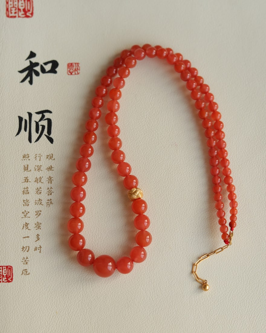 Natural Southern Red Agate Pagoda Necklace: This natural red agate pagoda necklace measures approximately 4.5 x 12 mm. It is flawless and free of impurities, paired with sterling silver and gold-plated twisted accessories a must-have for the Ne