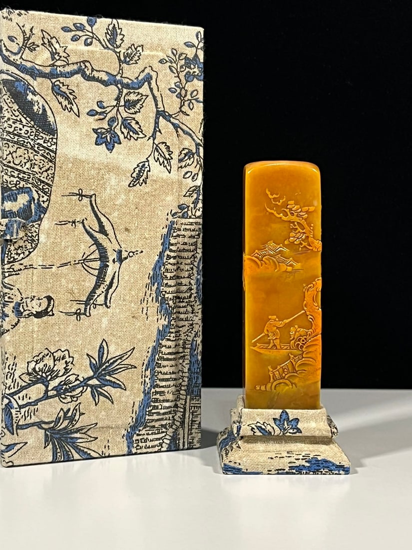 Tianhuang Stone Pine Tree Old Man Seal: A finely crafted Tianhuang stone seal depicting an old man under a pine tree. Dimensions: 14 x 3.5 cm. Net weight: 333 g. Artist: Qingqing. Provenance:Private Estate, San Diego, California. Our dedica