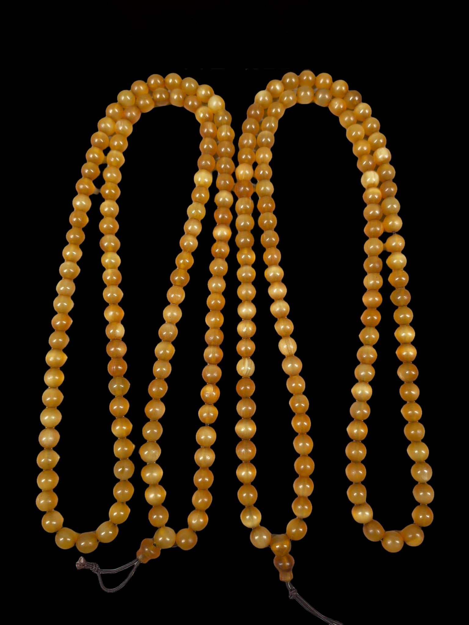 Two sets of 108-bead Buddhist prayer beads, part of the "Golden Armor" series. (1 of 9)