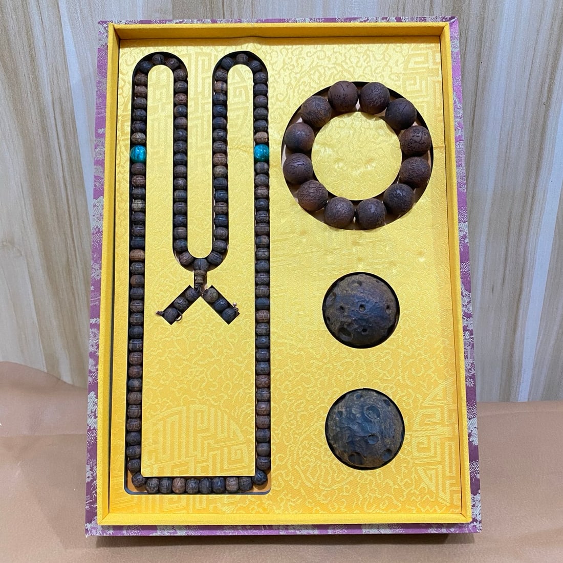 A pair of agarwood exercise balls, an agarwood carved bracelet, and an agarwood carved Buddhist bead (1 of 10)