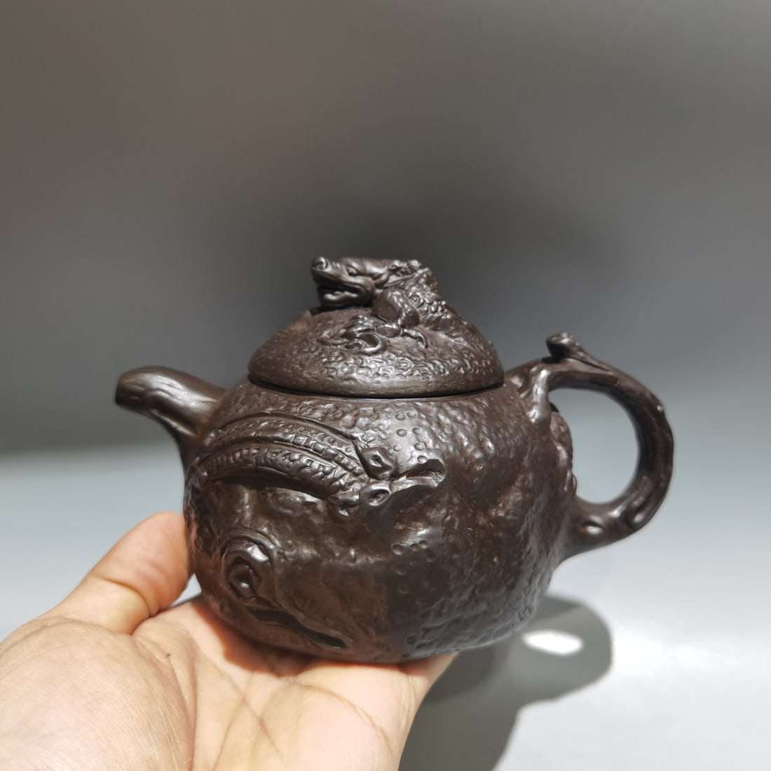 Name: Gongchun Dragon Teapot: Name: Gongchun Dragon Teapot; Bottom Mark: Xu Rulei; Size: 15 x 9 cm; Capacity: 360 cc; Clay: Original Purple Clay Provenance:Private collection from a professor in Yale University. Our dedicated team