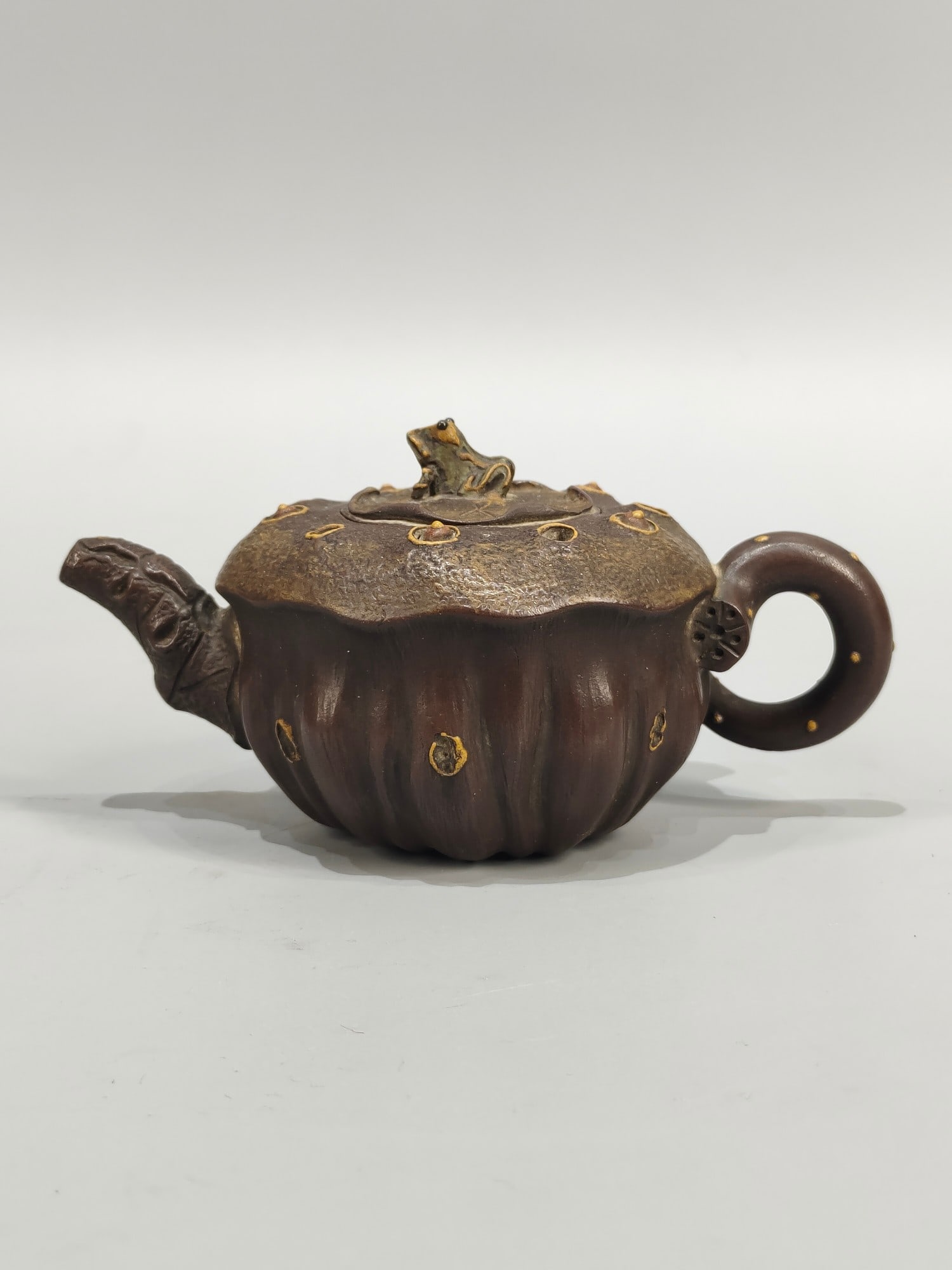 A rare, small-sized Yixing teapot with the inscription "Chen Mingyuan" on the bottom, featuring frog (1 of 7)