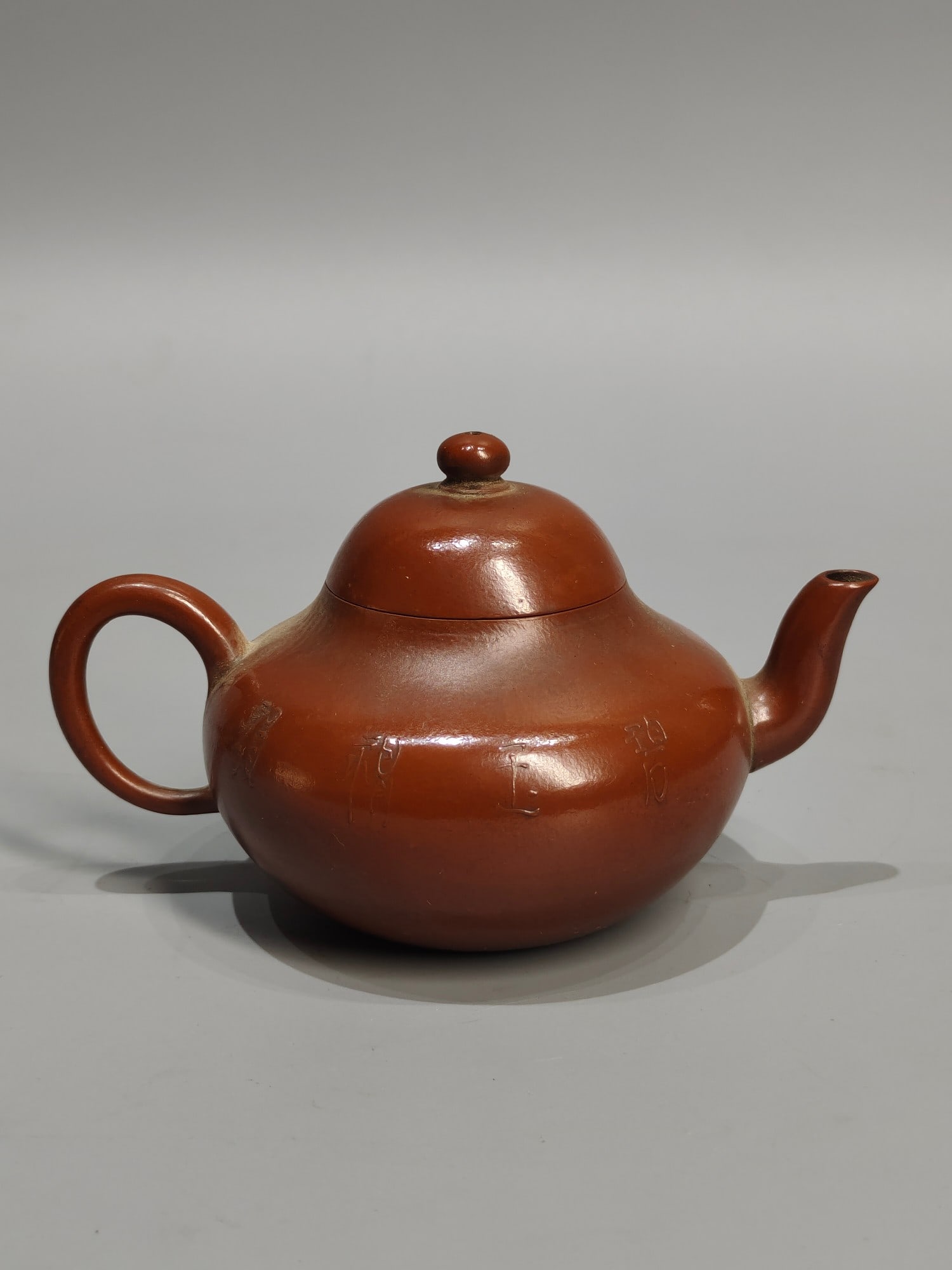 A treasured antique teapot, featuring a small piece titled "The Bright Moon Shines Upon Me, Meng (1 of 7)