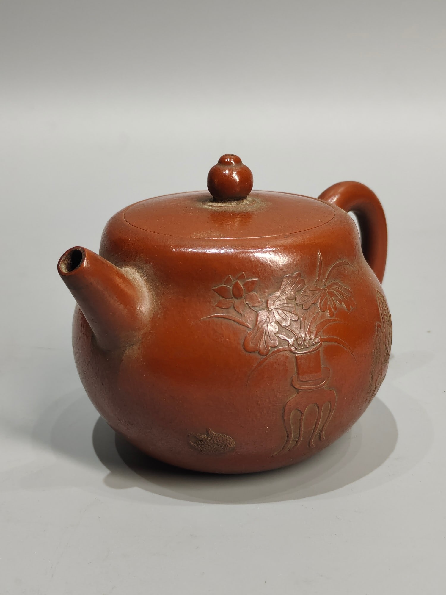 A treasured antique teapot, featuring a small piece titled "An Ancient Man in the Mountains, Meng (1 of 7)