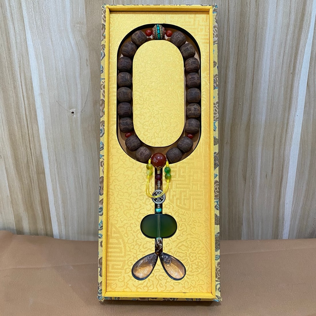 Agarwood carving of eighteen pieces for collection in a brocade box (1 of 9)