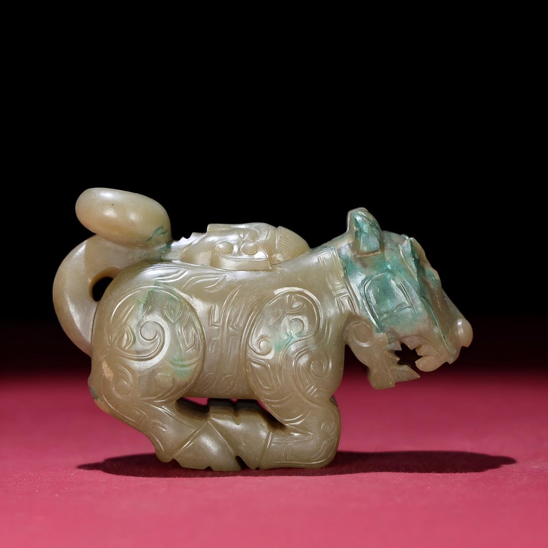 Exquisite antique collection, Hetian jade tiger handle piece with bronze patina.: A finely crafted, antique Hetian jade tiger-shaped handle piece with a thick, deep patina, showcasing exquisite craftsmanship and sharp carving. A rare and exceptional piece from a private collection.