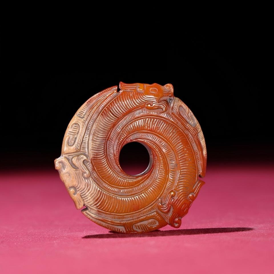 Exquisite antique, Shang and Zhou dynasty Manqin Xuanji Dragon Jade.: A finely crafted piece from a private collection, this Shang and Zhou dynasty jade disc features a thick, deeply patinated surface, showcasing exquisite craftsmanship and sharp carving. Dimensions: 58