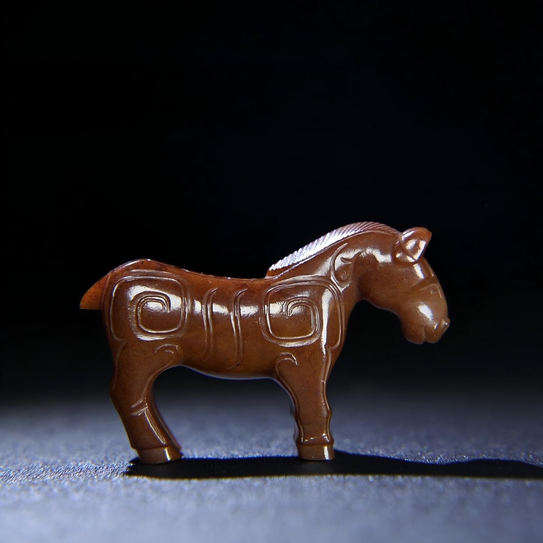 Exquisite antique piece, a small jade horse made of Hetian jade with full patina.: A fine, well-preserved piece from a private collection. This small jade horse, made of Hetian jade, has a thick, deep patina, with the color deeply embedded in the stone. The craftsmanship is exquisit