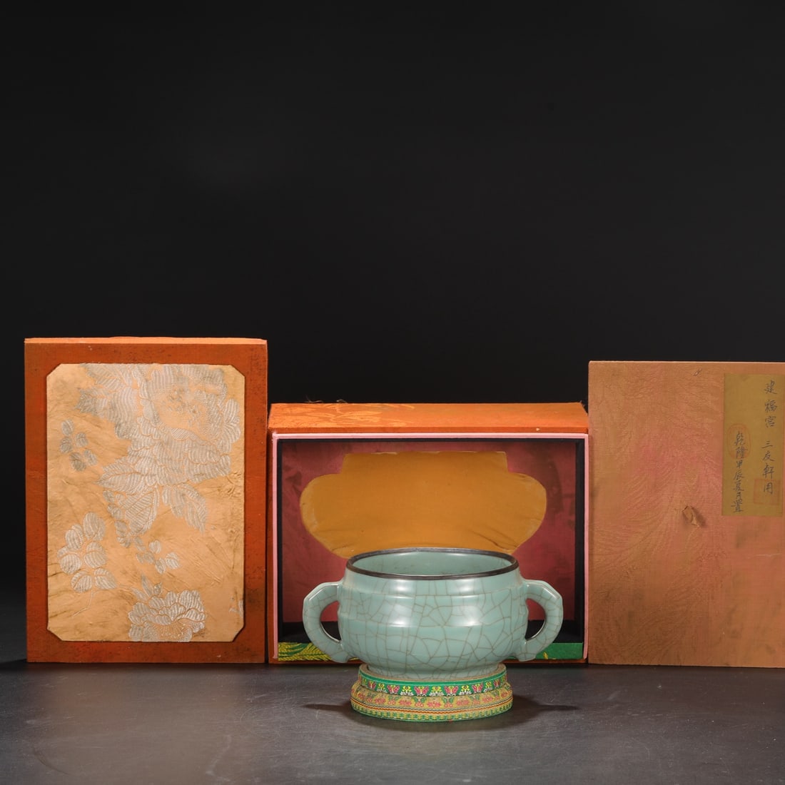 A large celadon-glazed silver-rimmed elephant-ear incense burner from the Southern Song Dynasty,: A Southern Song Dynasty official kiln celadon silver-rimmed elephant-ear large censer with an inscription by Emperor Qianlong. Dimensions: Height 10cm, Mouth diameter 15cm, Diameter 22cm. Provenance:P