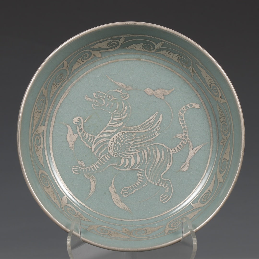 Formerly in the collection of a Song Dynasty Ru ware celadon-glazed plate with silver animal design (1 of 9)