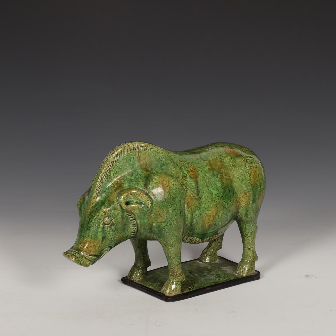 A Tang Dynasty Gongxian kiln marbled green-glazed silver-rimmed wild boar figurine. (1 of 9)