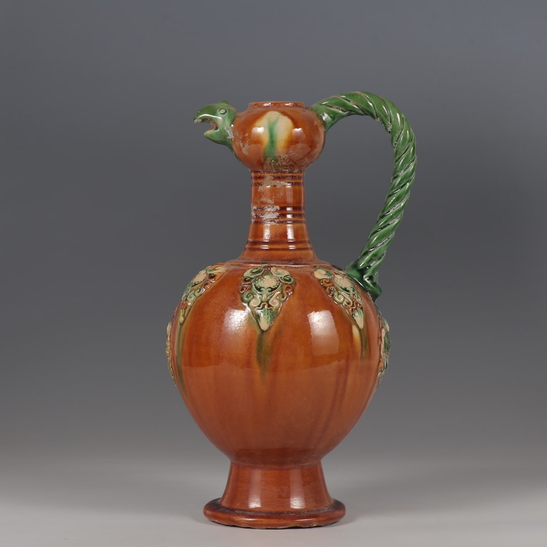 Formerly in the collection of Tang tri-color pottery ewer with applique phoenix head (1 of 9)