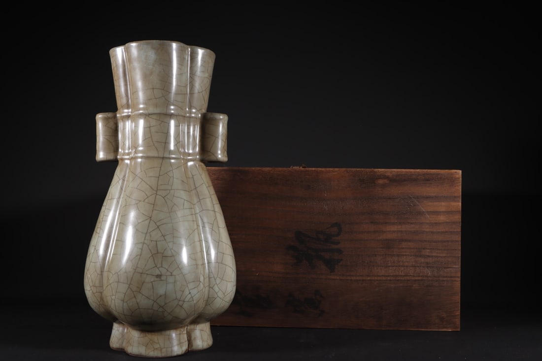 Formerly in the collection of a Song Dynasty official kiln celadon vase with flower-shaped rim and (1 of 9)