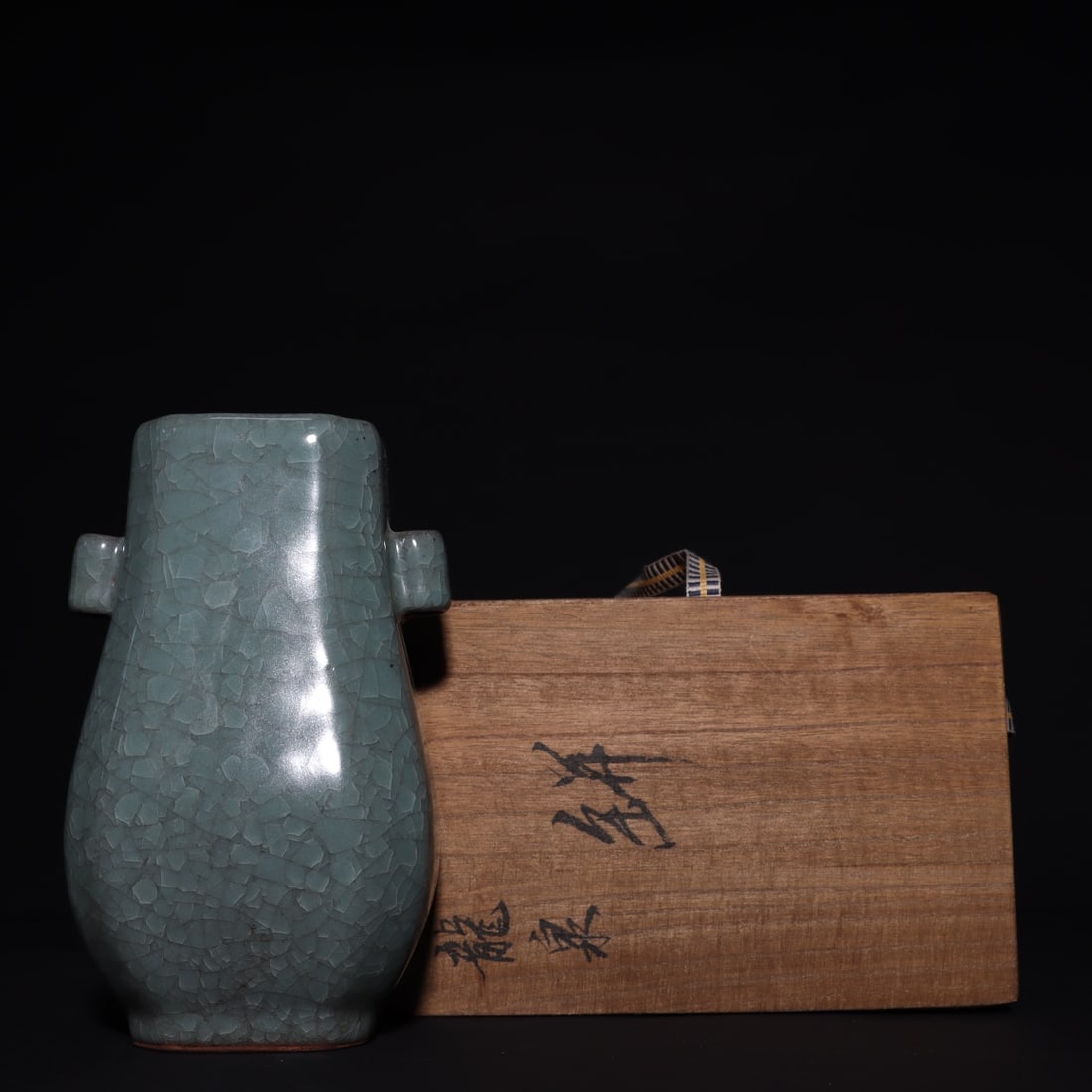 Formerly in the collection of a Song Dynasty Longquan vase with tubular handles: A Song Dynasty Longquan vase with tubular handles, formerly in the collection, measures 19cm in height and 11.2cm in width. Provenance:Private collection, Vancouver, Canada. Our dedicated team expertl