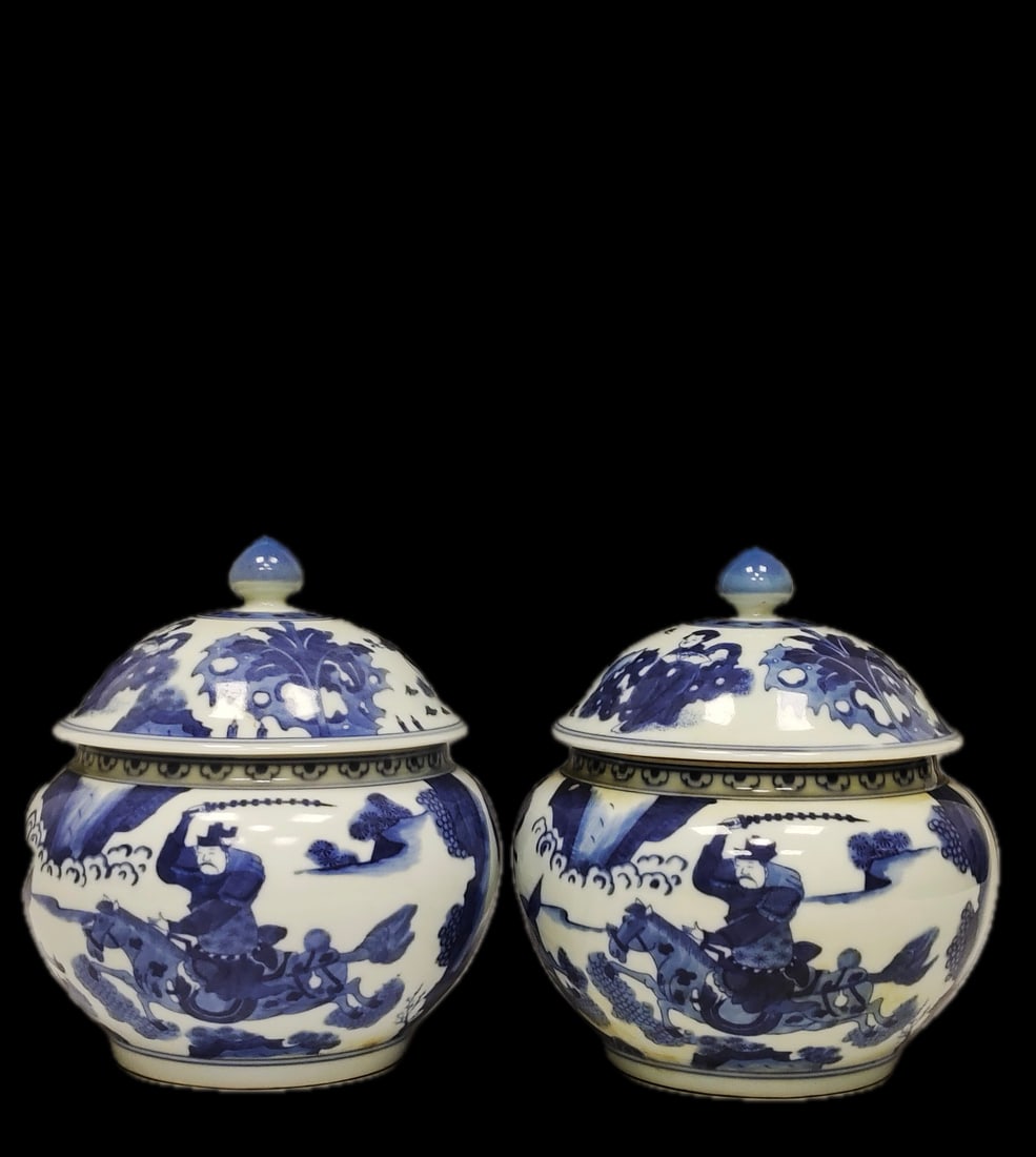 A pair of exquisitely crafted underglaze blue covered jars bearing the inscription "Made in the (1 of 9)