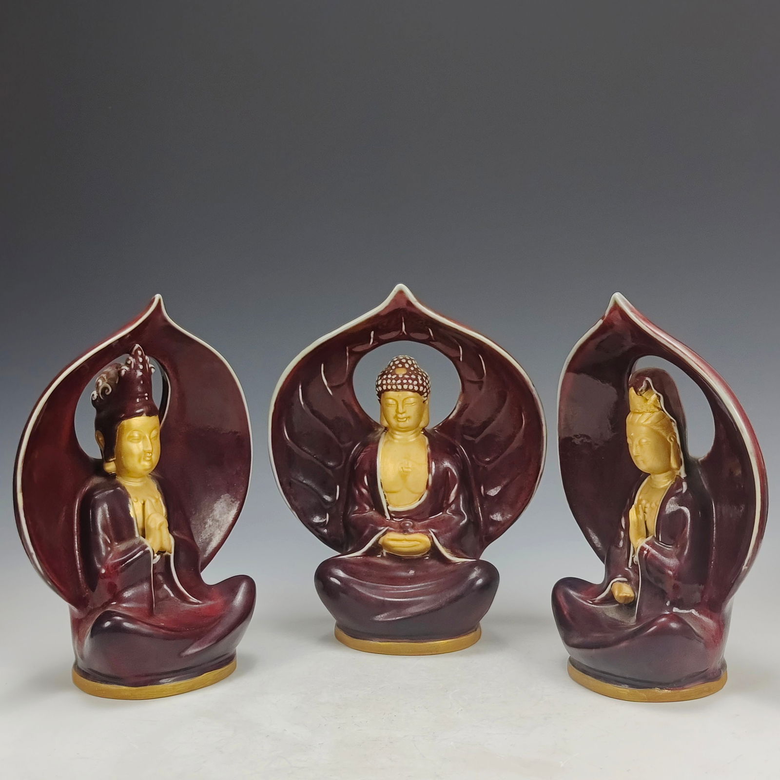 A set of exquisitely crafted, fully decorated monochrome red glaze and gold-painted backless seated (1 of 8)