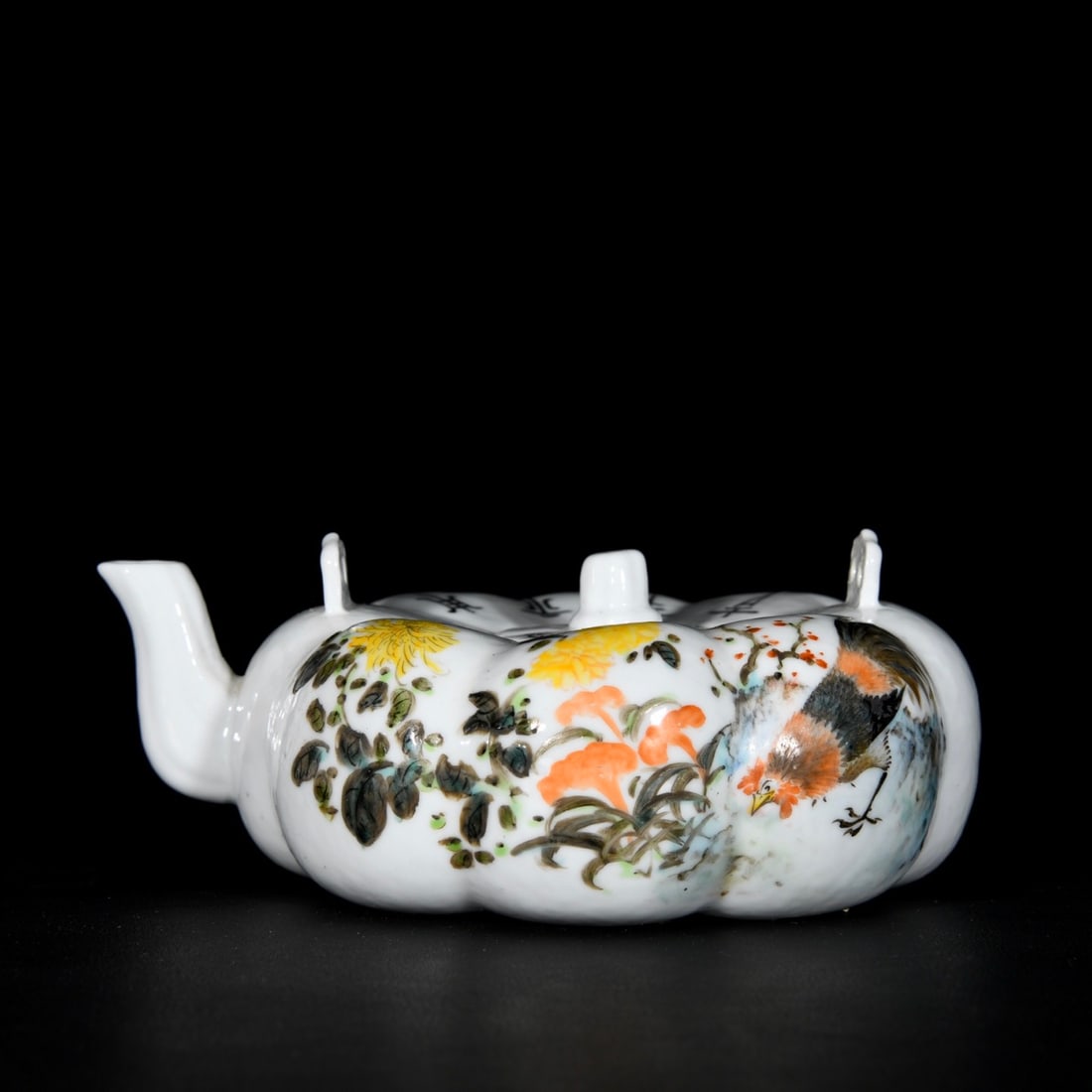 A famille rose enameled pumpkin-shaped teapot with flowers, birds, chrysanthemums, and other floral: A Republic-era famille rose pumpkin-shaped teapot with flowers, birds, chrysanthemums, and other floral and bird motifs, painted by Wang Zhang; 6.5 x 15.5 cm Provenance:Mr. Stefan, Minneapolis, Minnes