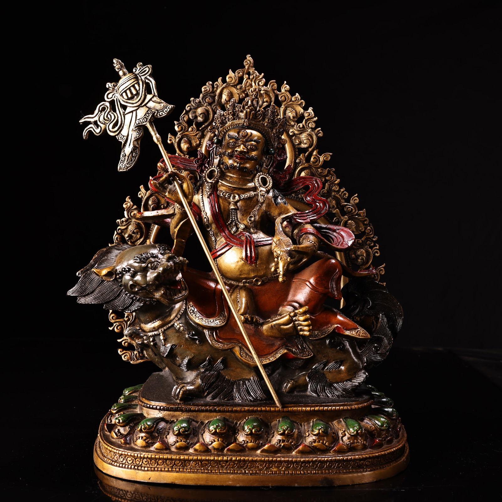 A pure copper, high-relief, engraved, painted, and gilded Tibetan Buddhist statue of the Treasure: Pure copper, high relief engraving, painting, and gilding, Tibetan Buddhist treasure king statue, 2800 grams, 33 cm high, 22 cm wide. Provenance:Private collection from a professor in Massachusetts In