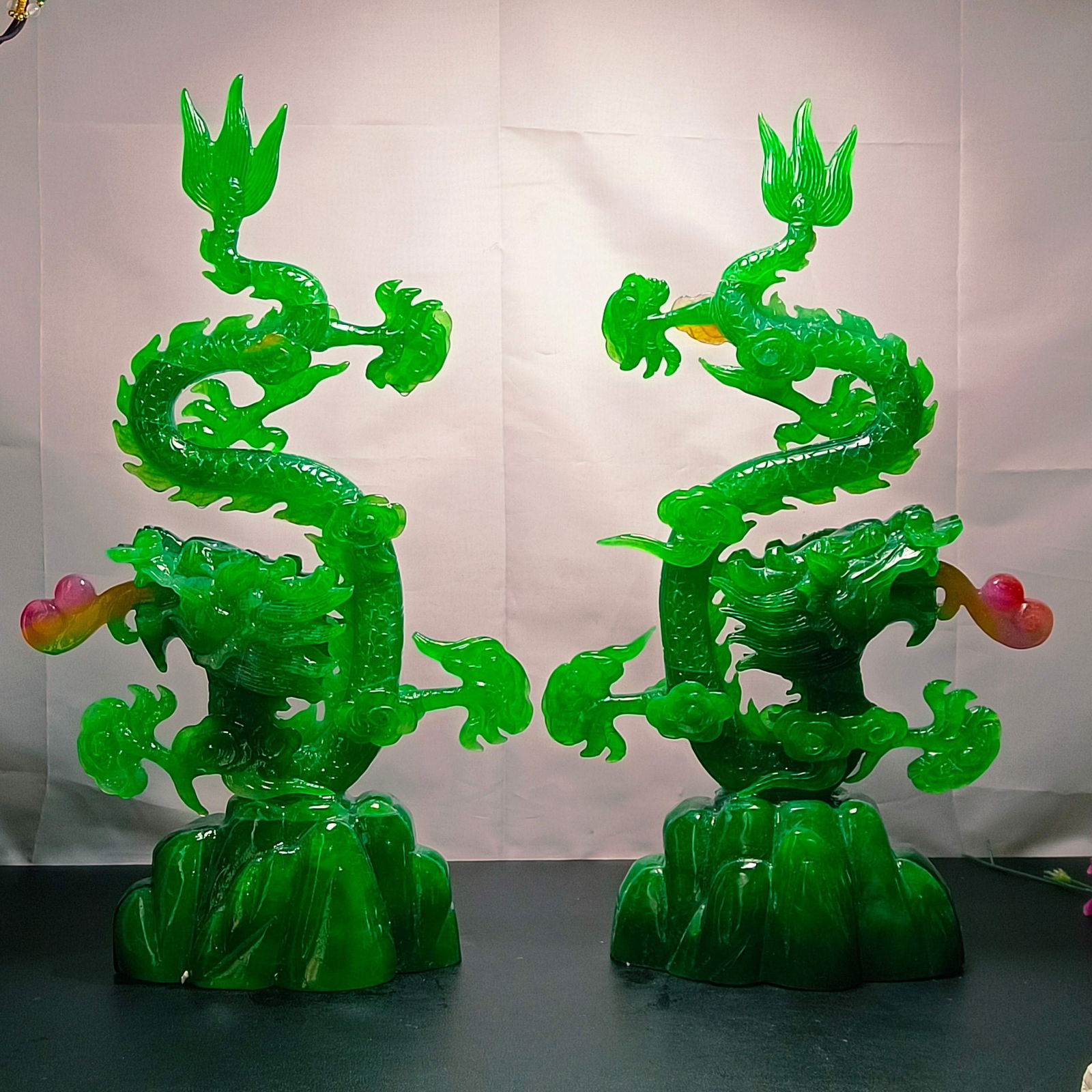 A pair of top-grade imperial green jadeite dragon ornaments: A pair of top-grade imperial green jadeite dragon ornaments Provenance:Private collection, Southern California. Our dedicated team expertly handles both domestic and global shipping arrangements.We al