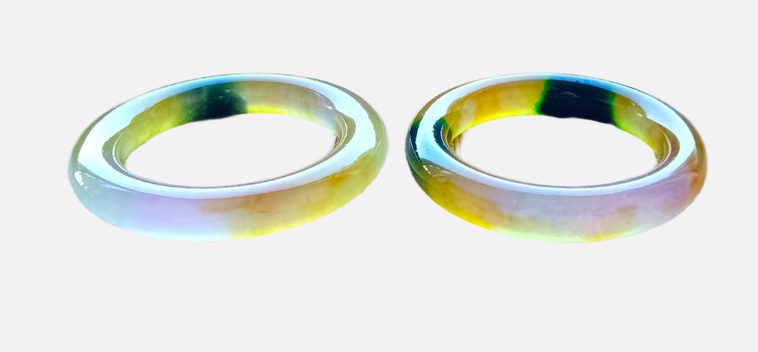 A pair of top-grade dragon stone type multicolored jadeite bangles (1 of 5)