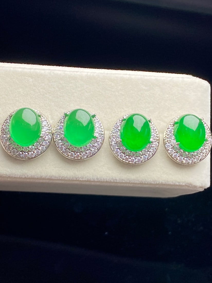 Jadeite earrings with a full green, icy texture.: Jadeite earrings, made of icy green jadeite, are lustrous and translucent, exquisitely three-dimensional, and flawlessly free of cracks. Provenance:Mrs. Blair, Newport Beach, California. Our dedicated