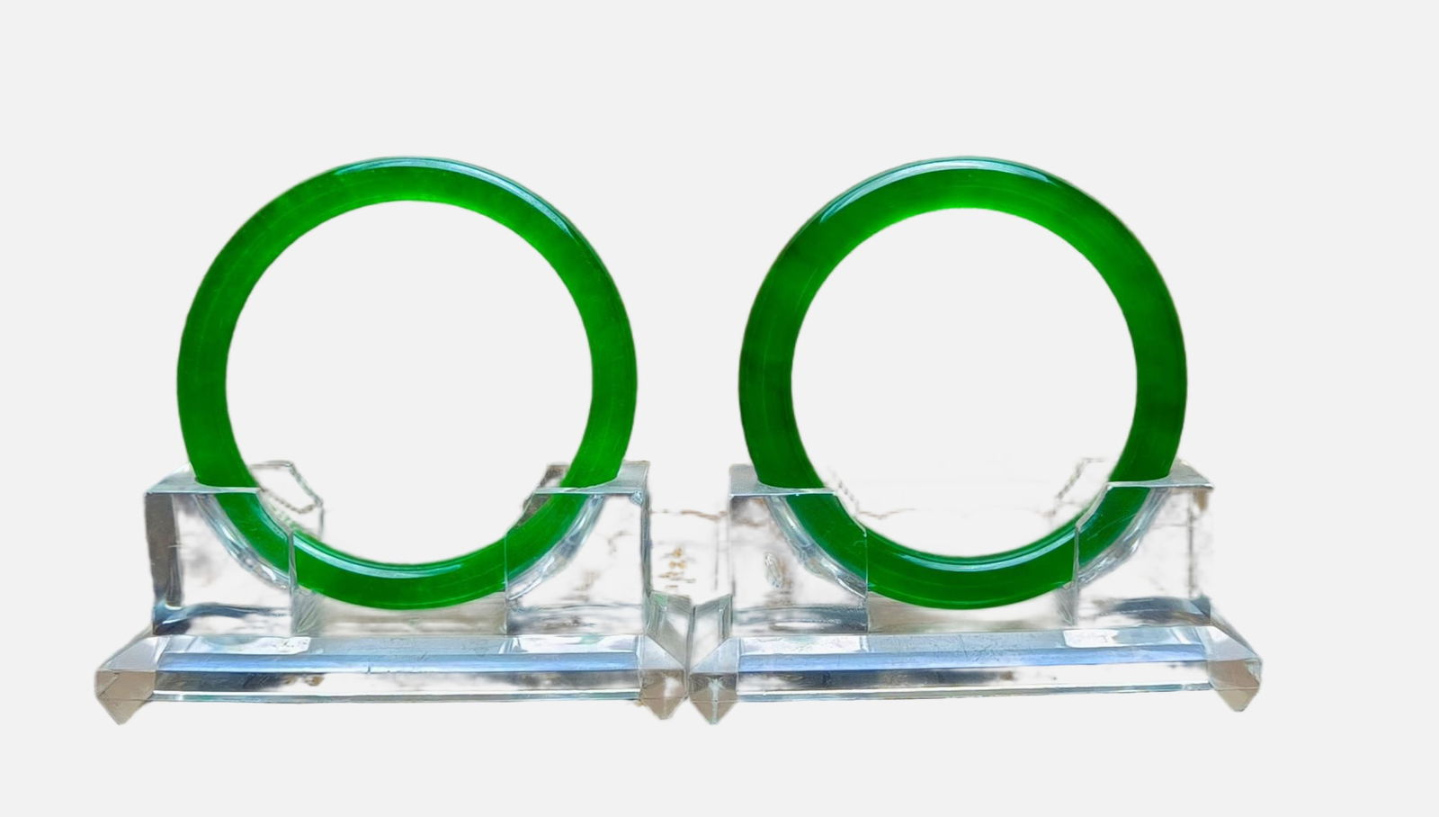 A pair of top-grade dragon stone imperial green jadeite bracelets (1 of 6)